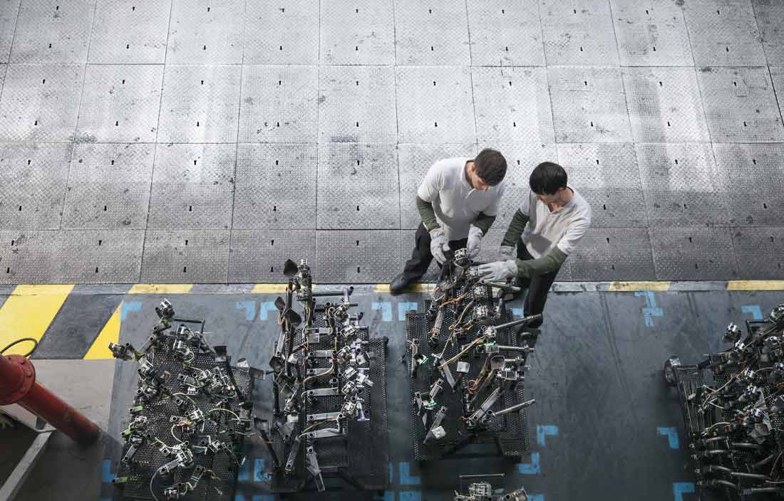 Automotive workers in a factory.