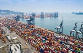View of a harbor with cargo and shipping containers