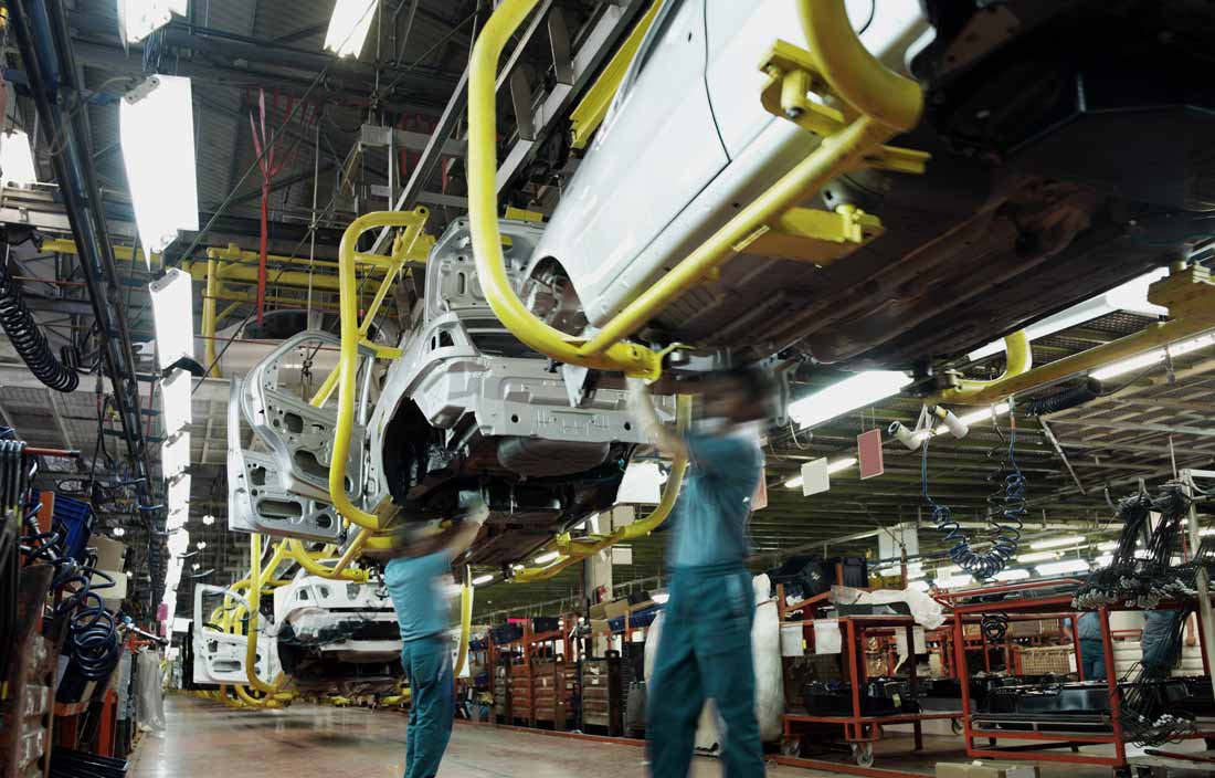 Factory workers in an assembly line.