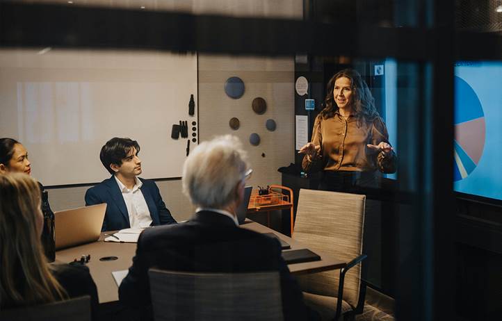 Business professional presenting on the importance of data and analytics.