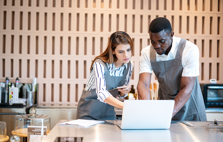 Business owners checking a laptop together