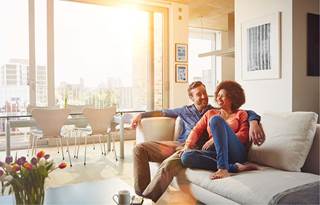 Young couple discussing the FIRE movement and retiring early.