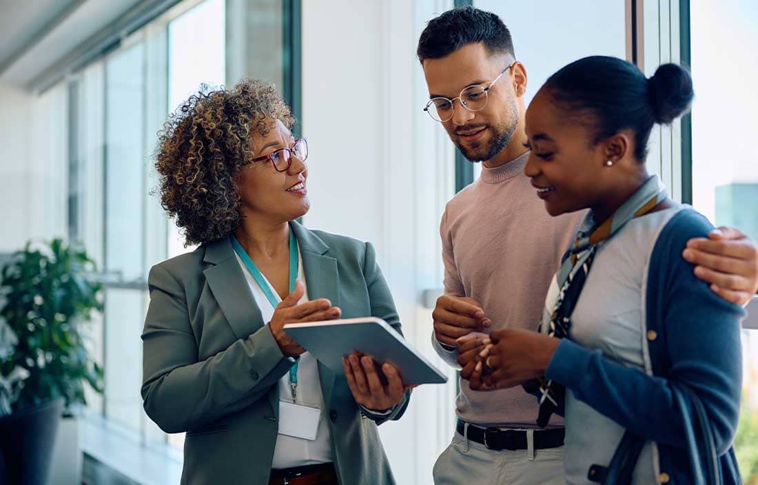 Couple talking to their financial advisor.