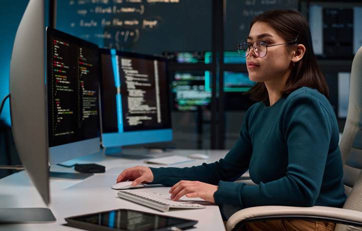 Cybersecurity professional working on their computer.