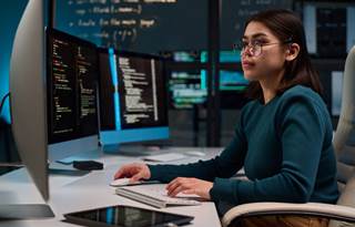 Cybersecurity professional working on their computer.