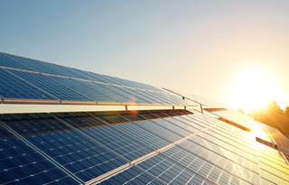 Sun shining off solar panels.