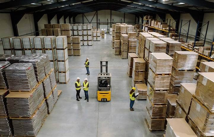 Top view of warehouse workers in warehouse.