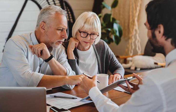 Older couple exploring the complexities of charitable estate planning.