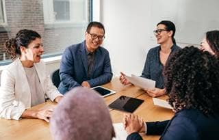 Group of nonprofit professionals discussing ERP value.