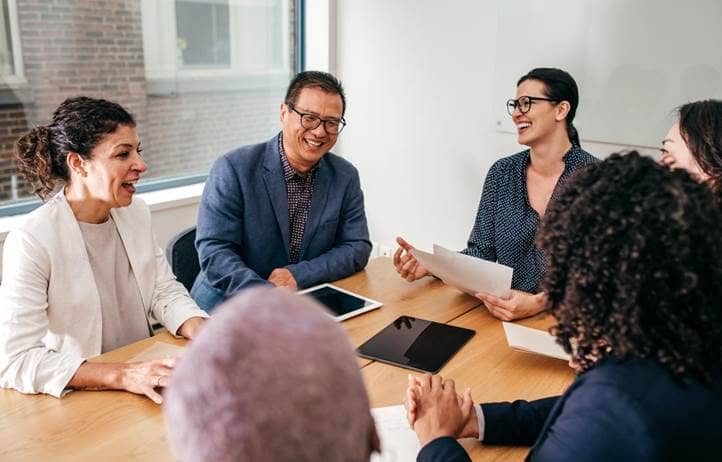 Group of nonprofit professionals discussing ERP value.