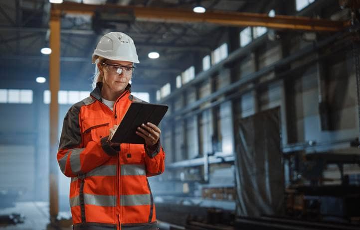 Manufacturing worker in a protective hardhat while in a warehouse