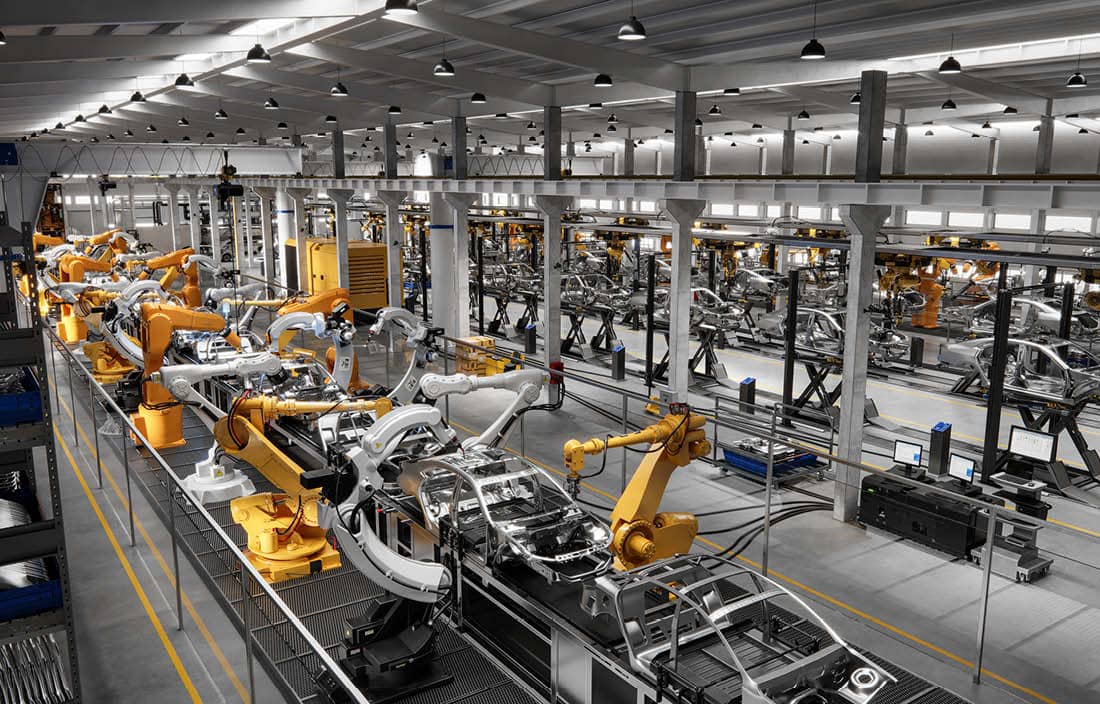 Automobile being assembled in a factory.