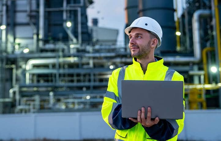 Construction worker in a hard hat and high-vis jacket.