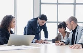 Cybersecurity professionals in a modern conference room.