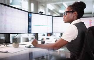 Banking professional working on their computers.