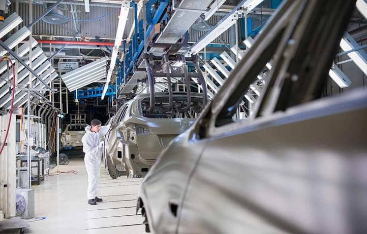 Auto worker in an automotive factory.