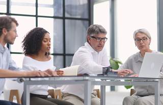 Group of tax professionals in a meeting.