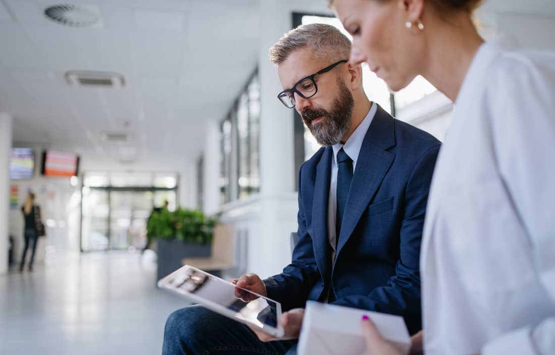 Business professional meeting with a doctor. 