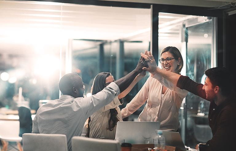 People high fiving each other