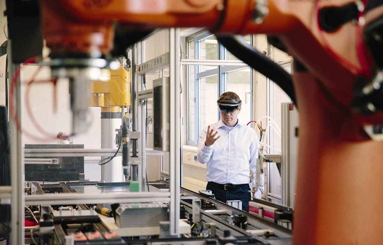 Man in a lab wearing a VR headset