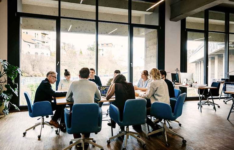 Business people in a modern day conference room having a meeting.