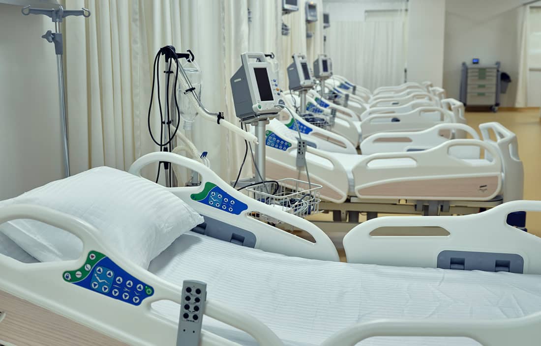 Empty hospital beds.