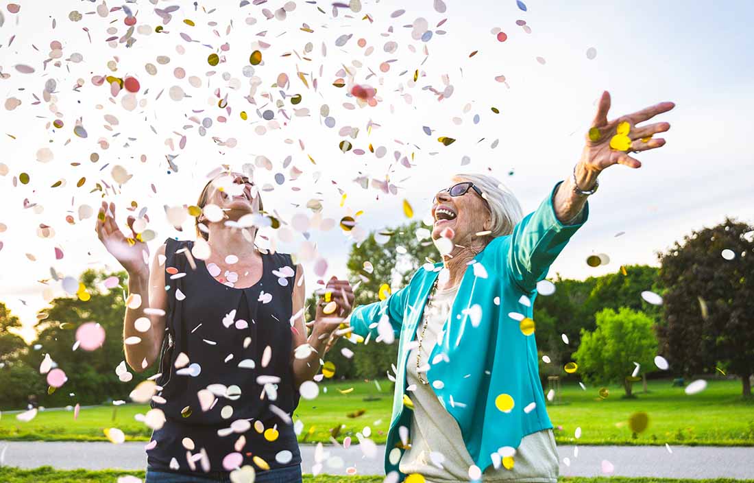 Two people celebrating with confetti.