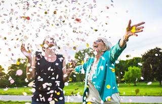 Two people celebrating with confetti.