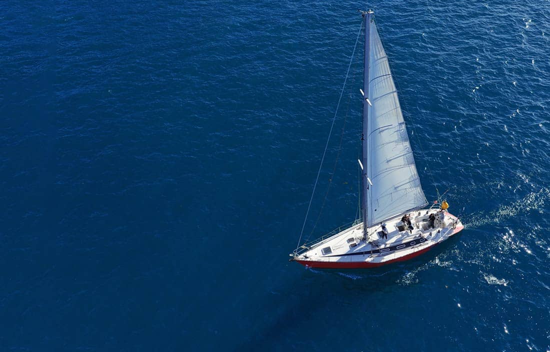 Sailboat gliding through the water.