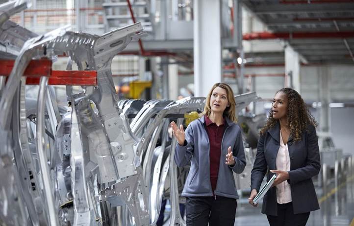 Diverse group of professionals discussing external audit.