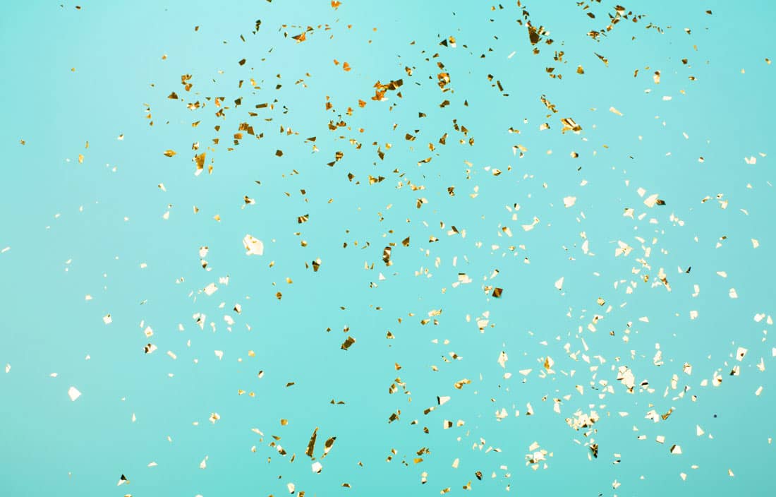 Confetti against a light blue background.