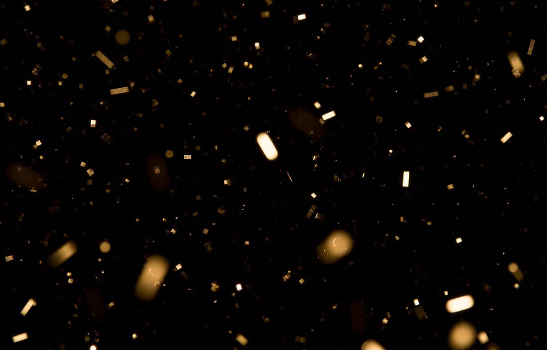 Confetti against a black background.