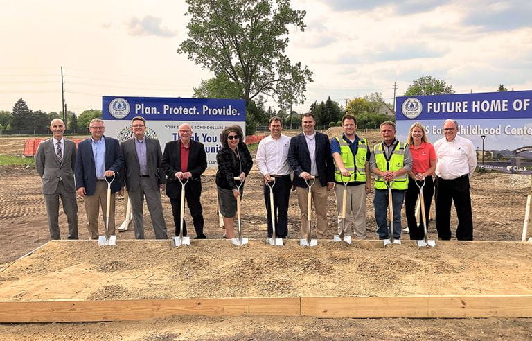 Livonia Public Schools Early Childhood Center Groundbreaking ceremony with district and project staff posing with shovels