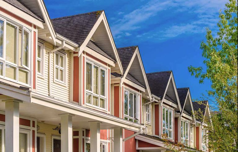 Image of similar homes in a row for article about funding cuts to HUD and Section 202 housing impacts low-income seniors