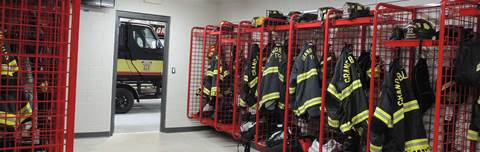Interior of fire station with firefighter jackets.