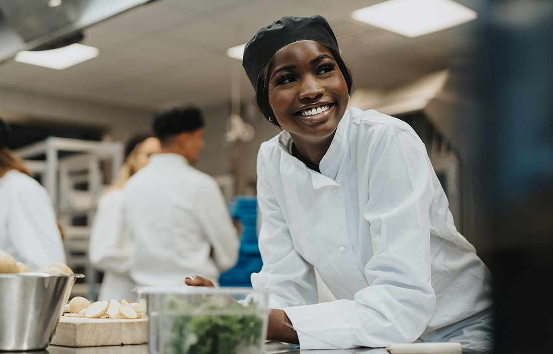 Chef working in school cafeteria.