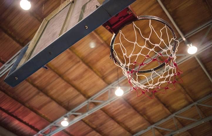 Photo of a basketball hoop as seen from below