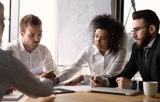 Real estate professionals discussing Delaware statuatory trusts.