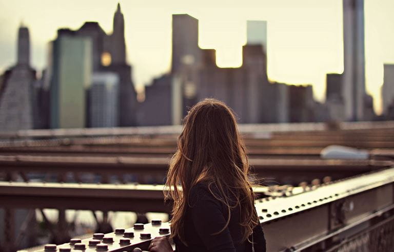 Woman overlooking a cityscape