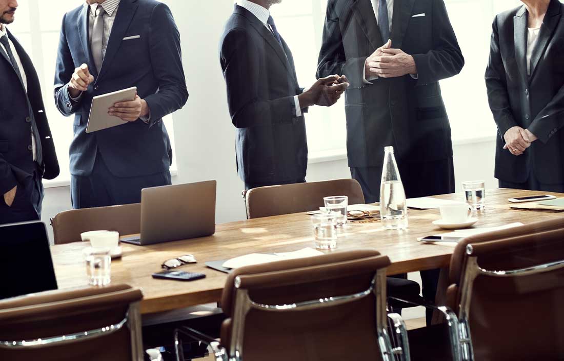 Coworkers around a meeting table