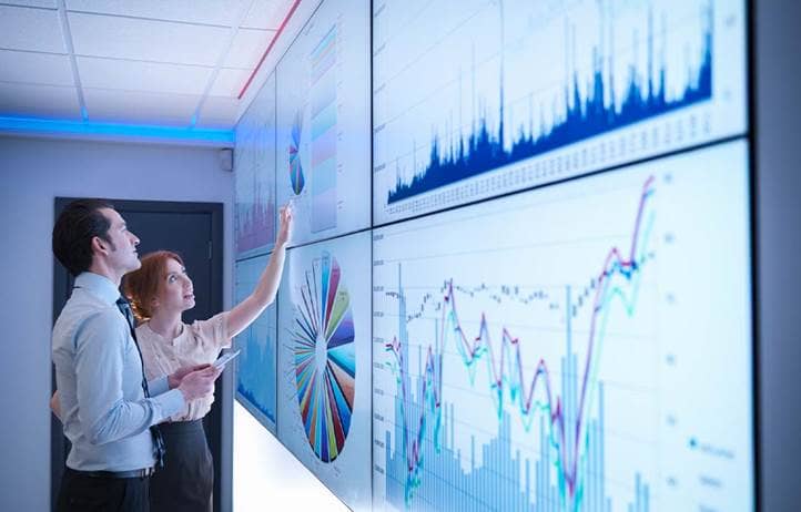 Man and woman looking at chart