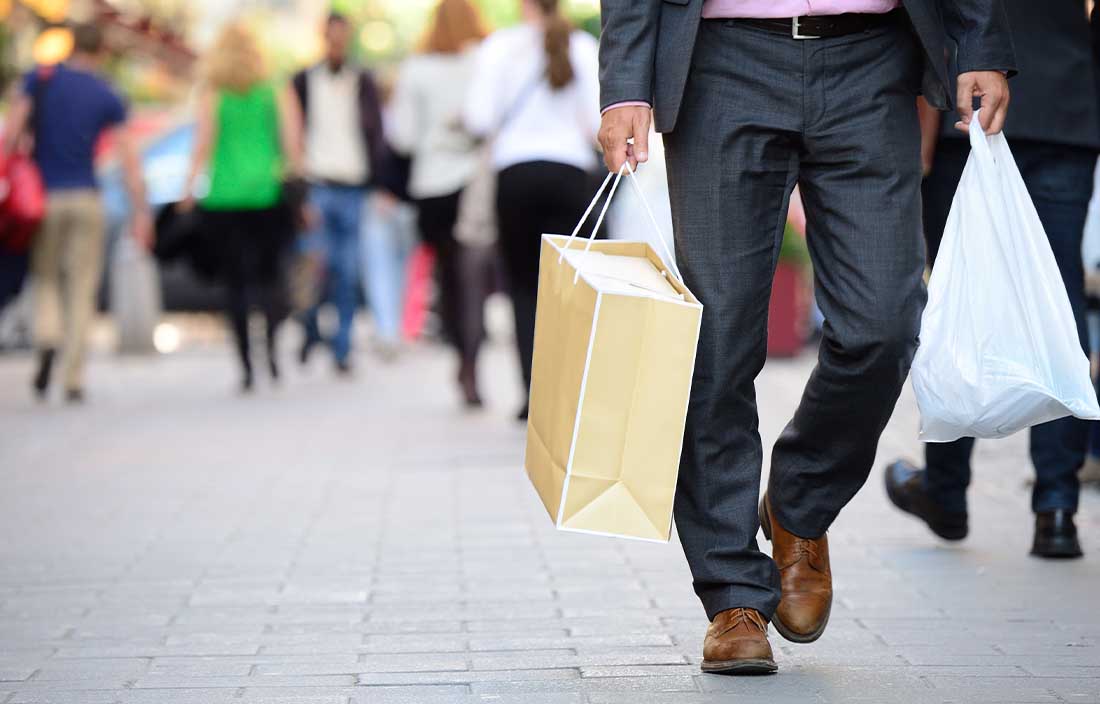 Person at a shopping center with retail items