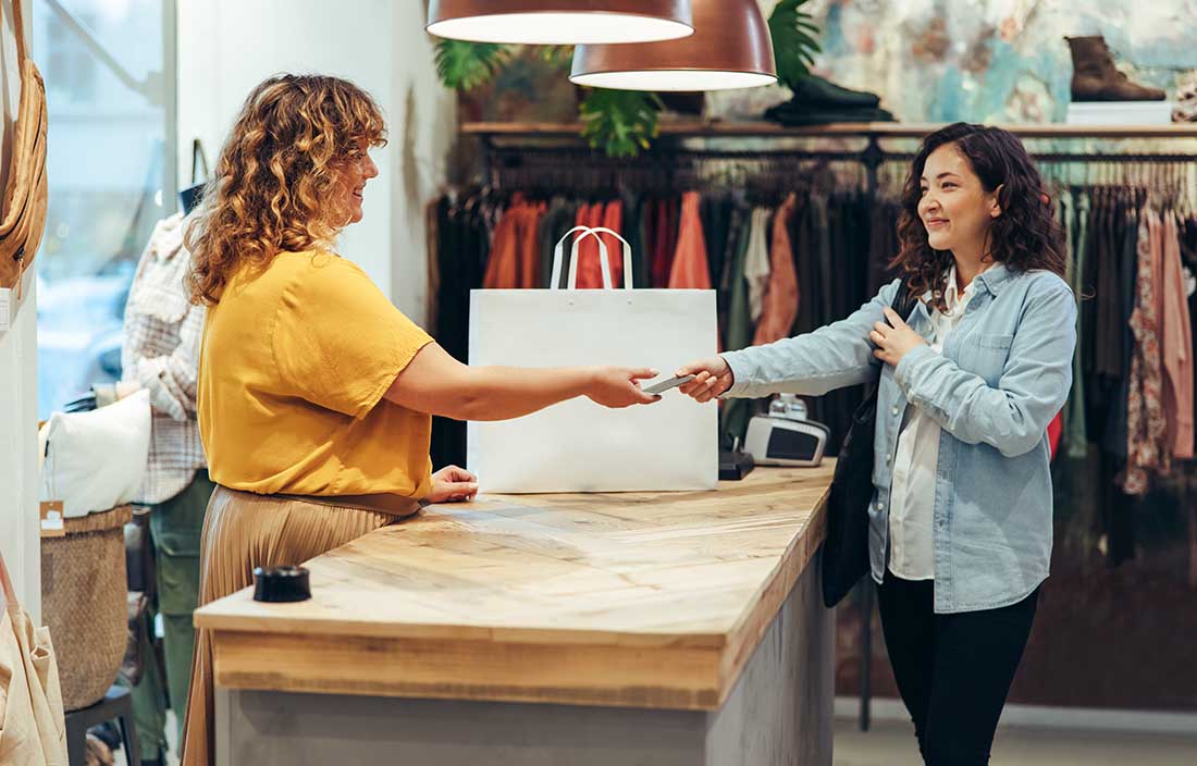 Consumers shopping at a clothing store.