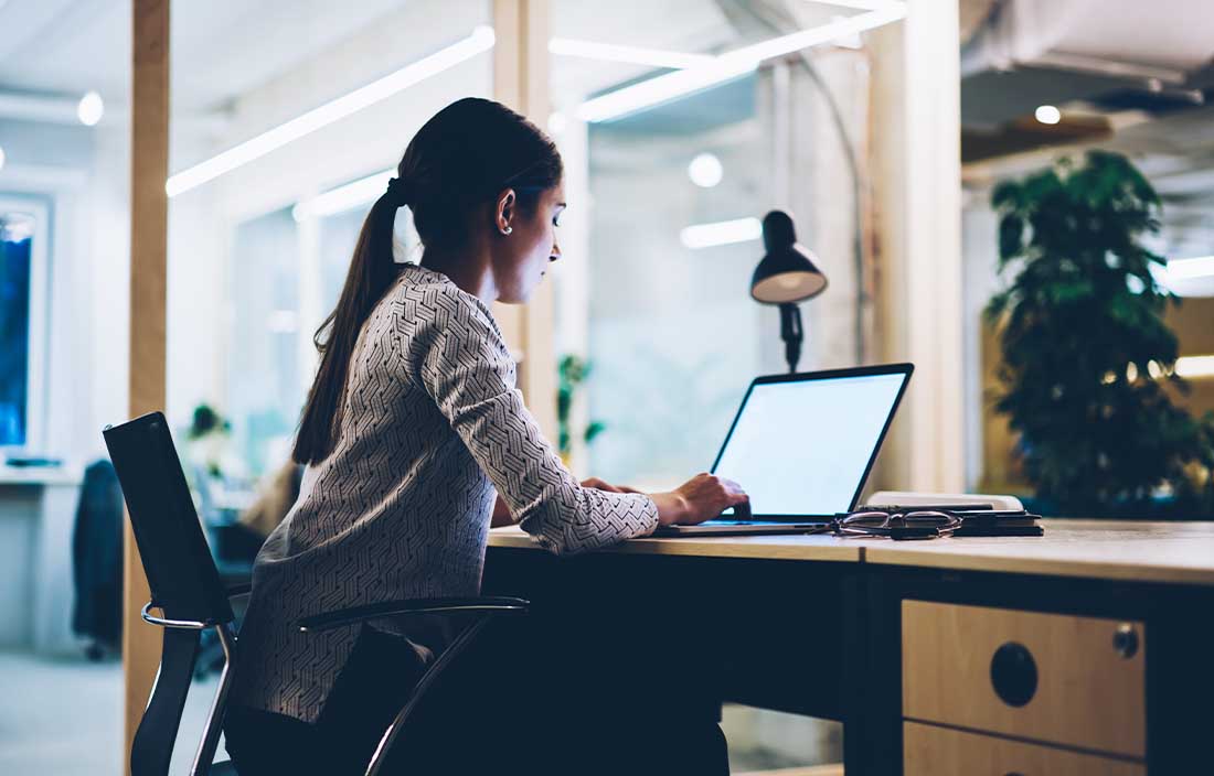 Woman looking at retail sales data on her computer