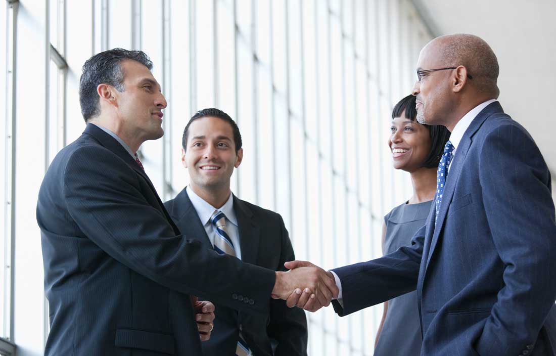 Group of people shaking hands 