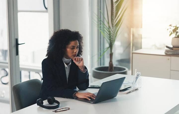 Woman looking at a computer screen.