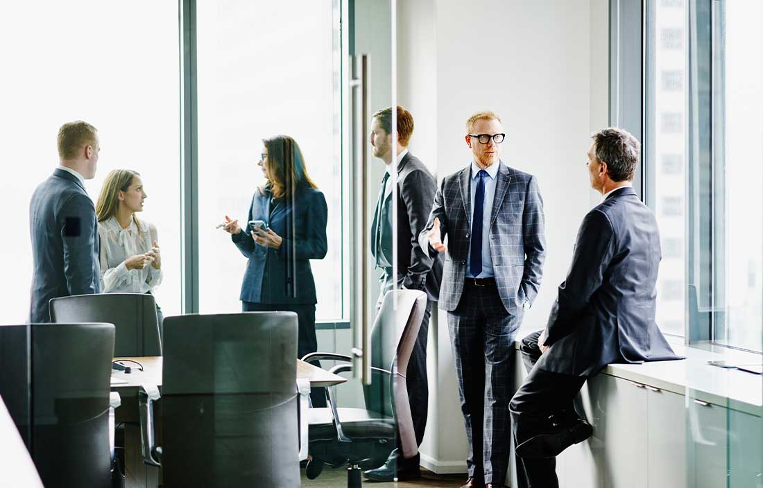 Businesspeople in conference room having a conversation about the election