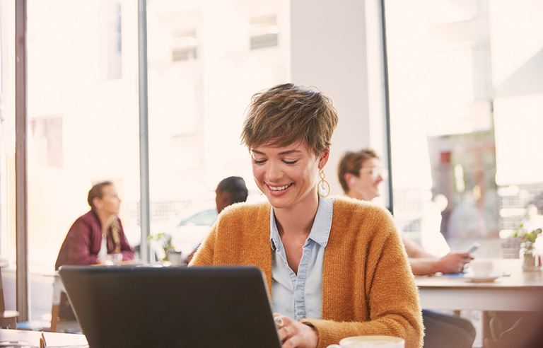 woman smiling at laptop